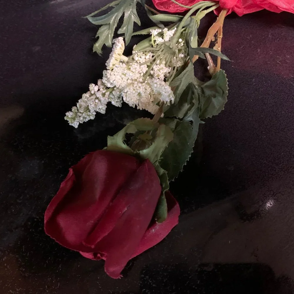 One Red rose with baby's breath and bow